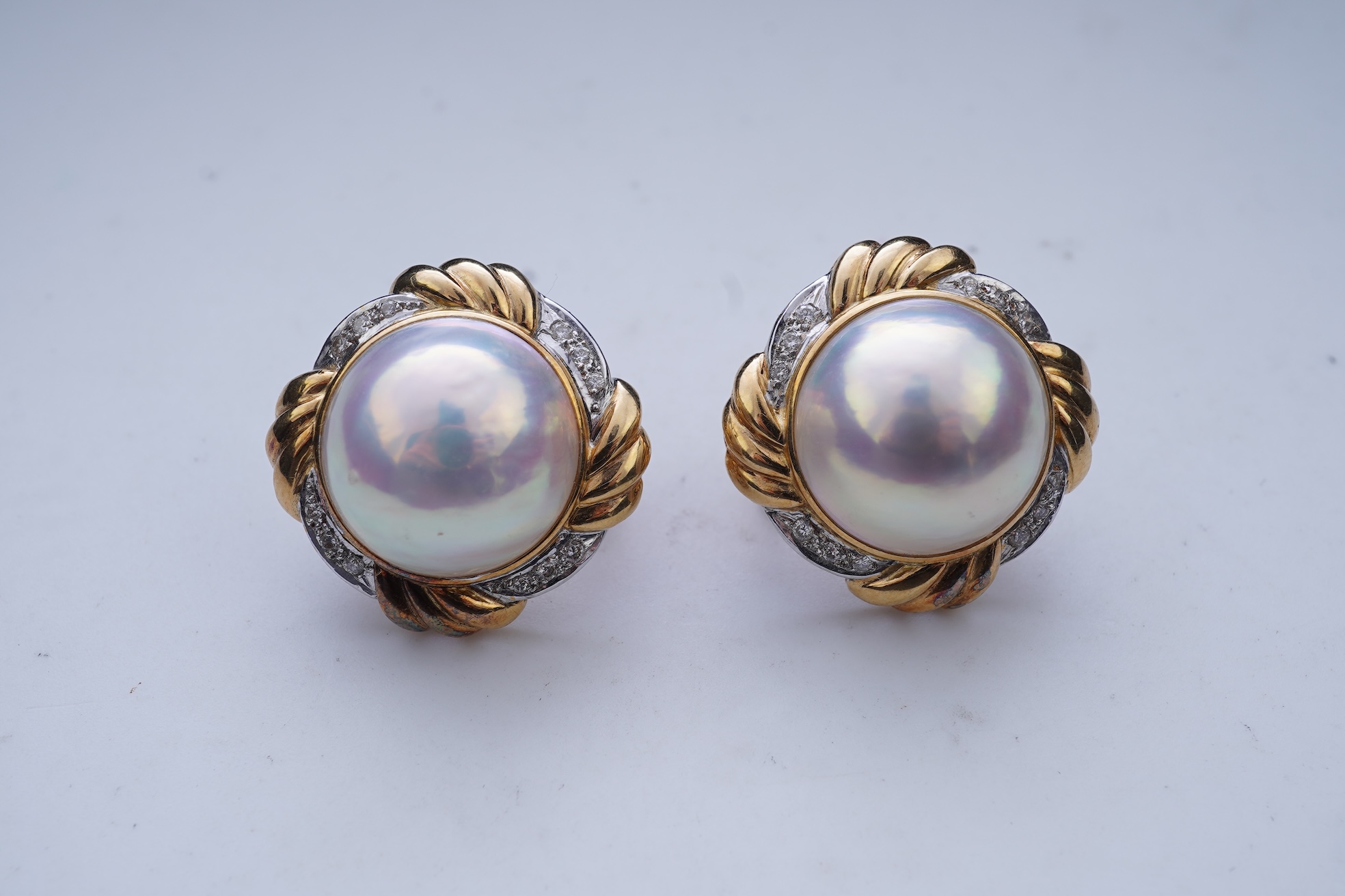 A pair of mabé cultured pearl and diamond earrings